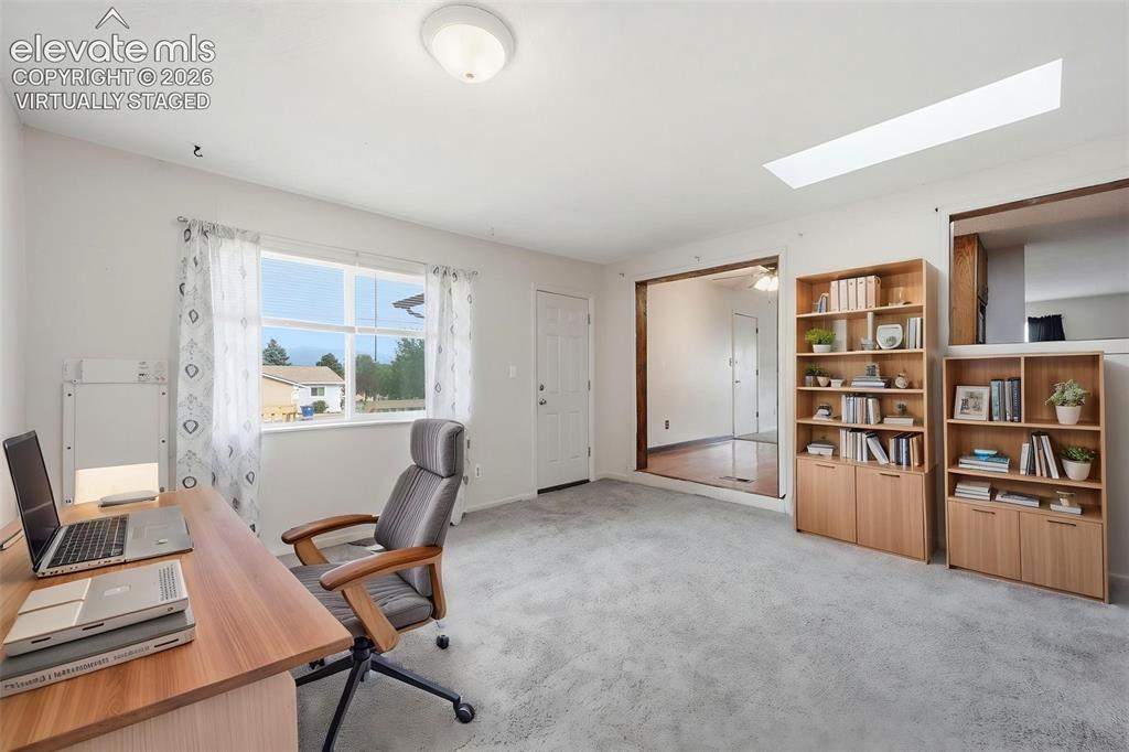 Image 25 of 47: Virtually Staged Family Room as Office