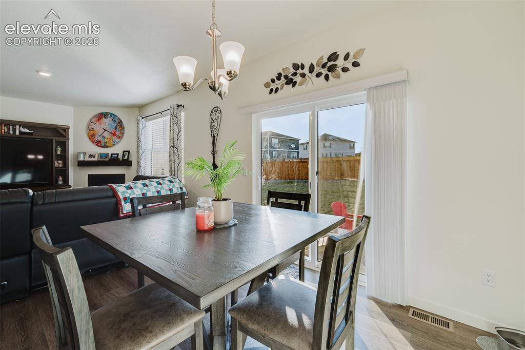 Image 11 of 47: View of the Living Room from the Dining Nook.