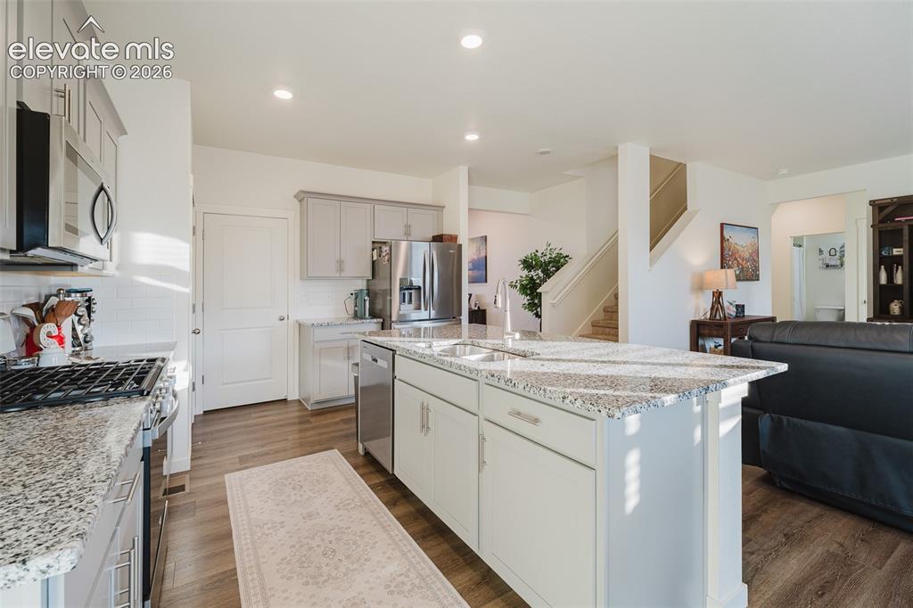 Image 14 of 47: Stainless Steel Appliances include a gas range oven, microwave, dishwasher,