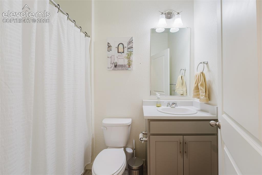 Image 22 of 48: Main Level Full Bathroom with vanity, mirror, and tub/shower.