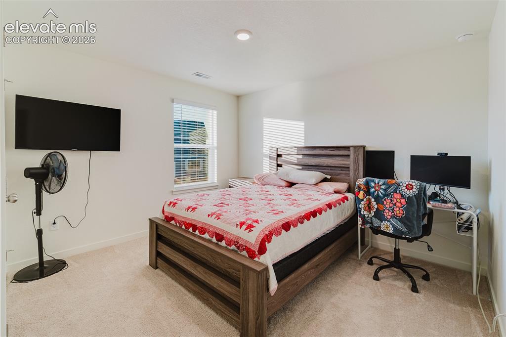 Image 35 of 47: Upper Level Bedroom #4 with neutral carpet.