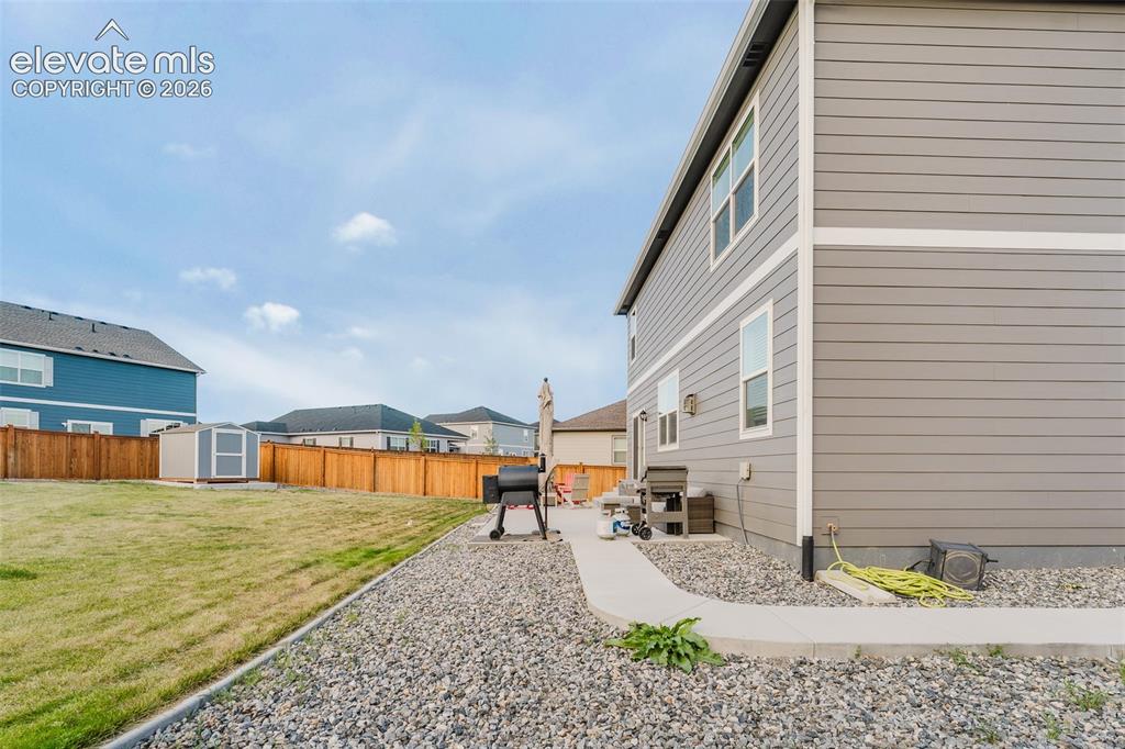 Image 41 of 47: View of fenced backyard.