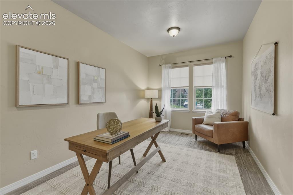 Image 15 of 49: Hardwood-style flooring throughout