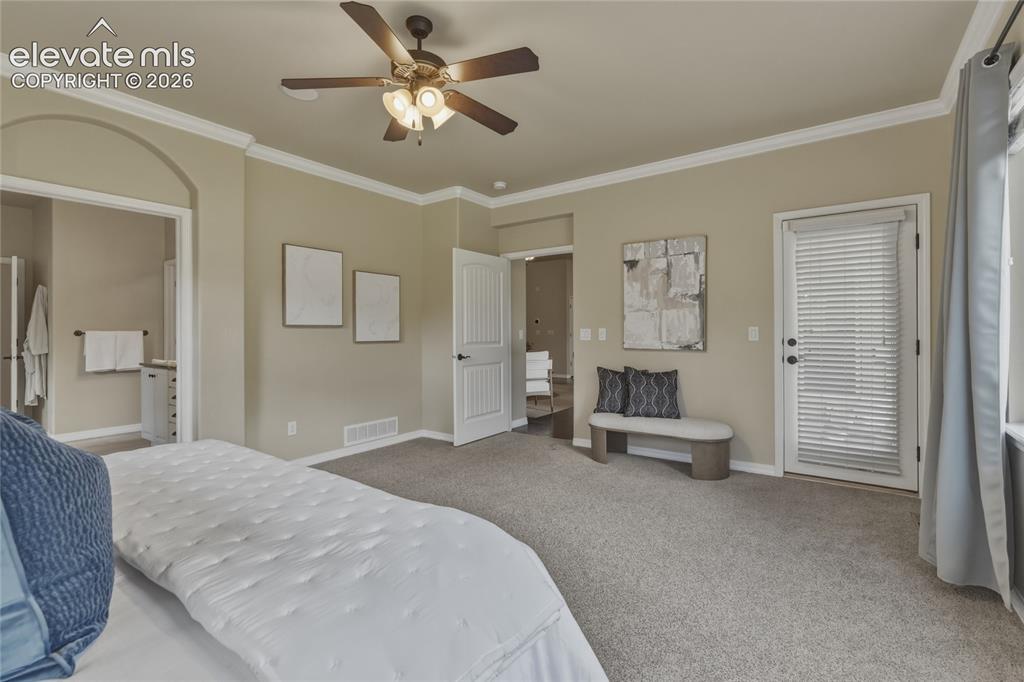 Image 19 of 49: Carpeted flooring, ceiling fan with integrated lighting, crown molding, whi