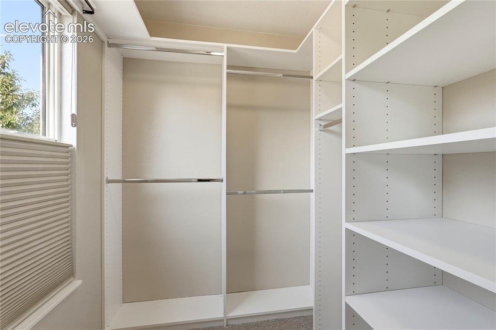 Image 19 of 49: Primary Bedroom Walk-in Closet