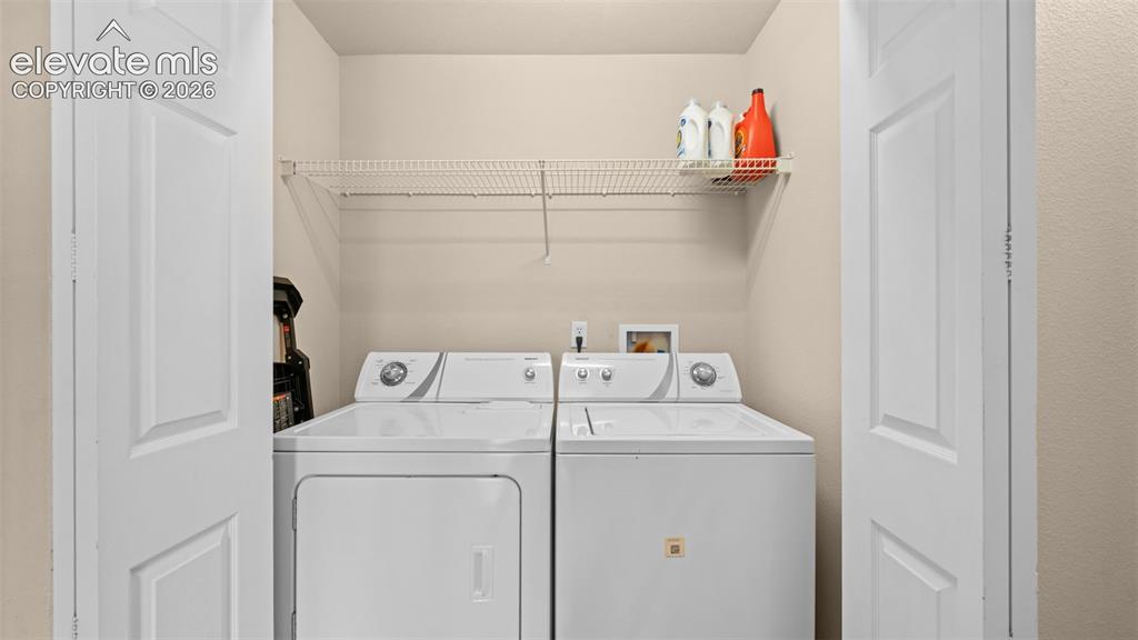 Image 21 of 33: Dedicated laundry closet with bi-fold doors