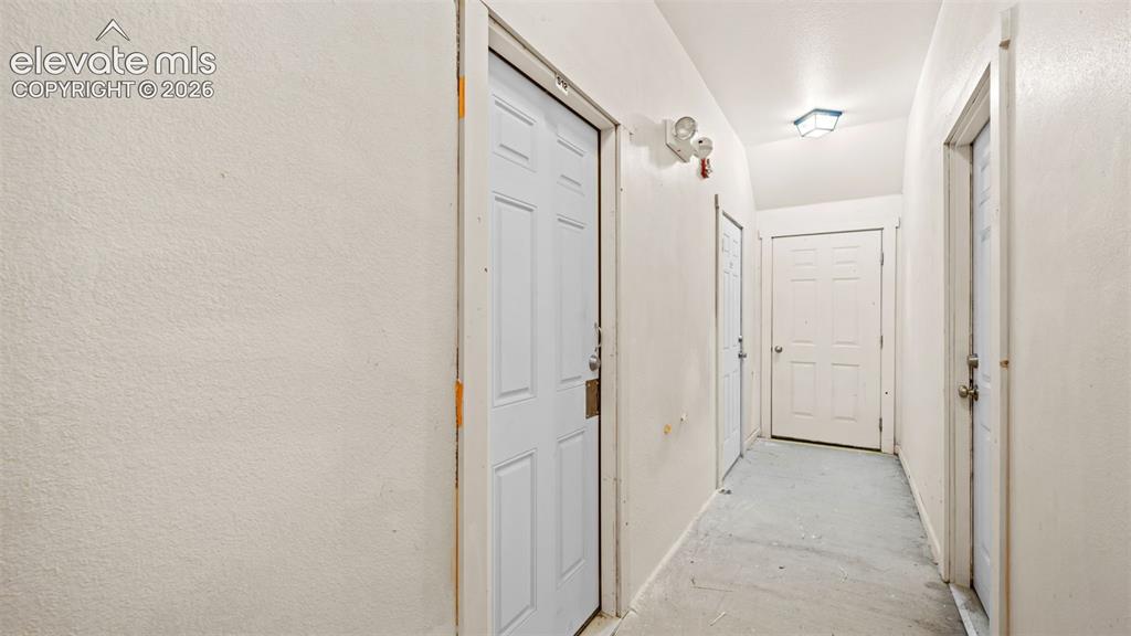 Image 32 of 33: Basement Hallway door to storage unit.