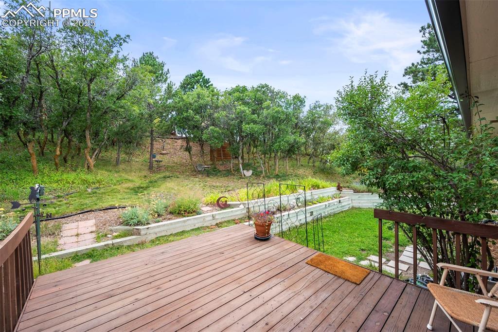 Image 17 of 22: Unit A back deck.  Note terracing already in place and wonderful private fe