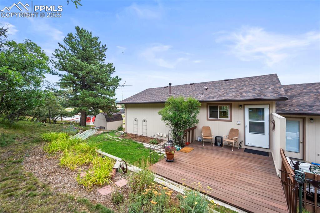Image 20 of 22: Unit A back deck from yard.