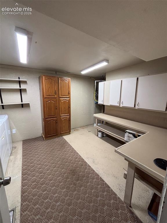 Image 11 of 18: Laundry/Craft and utility room in the basement