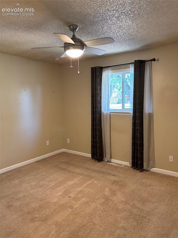 Image 3 of 18: Bedroom on rear of house, spacious with generous closet.