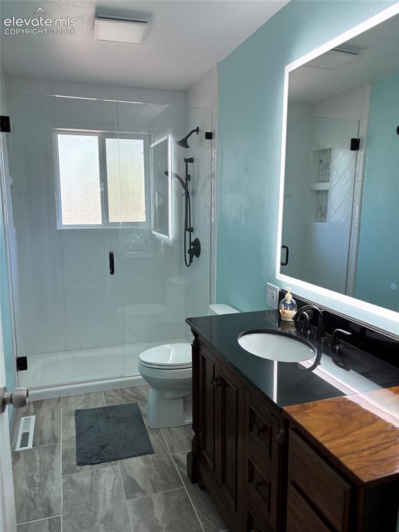 Image 4 of 18: Oversized, luxury shower on main level remodeled bath