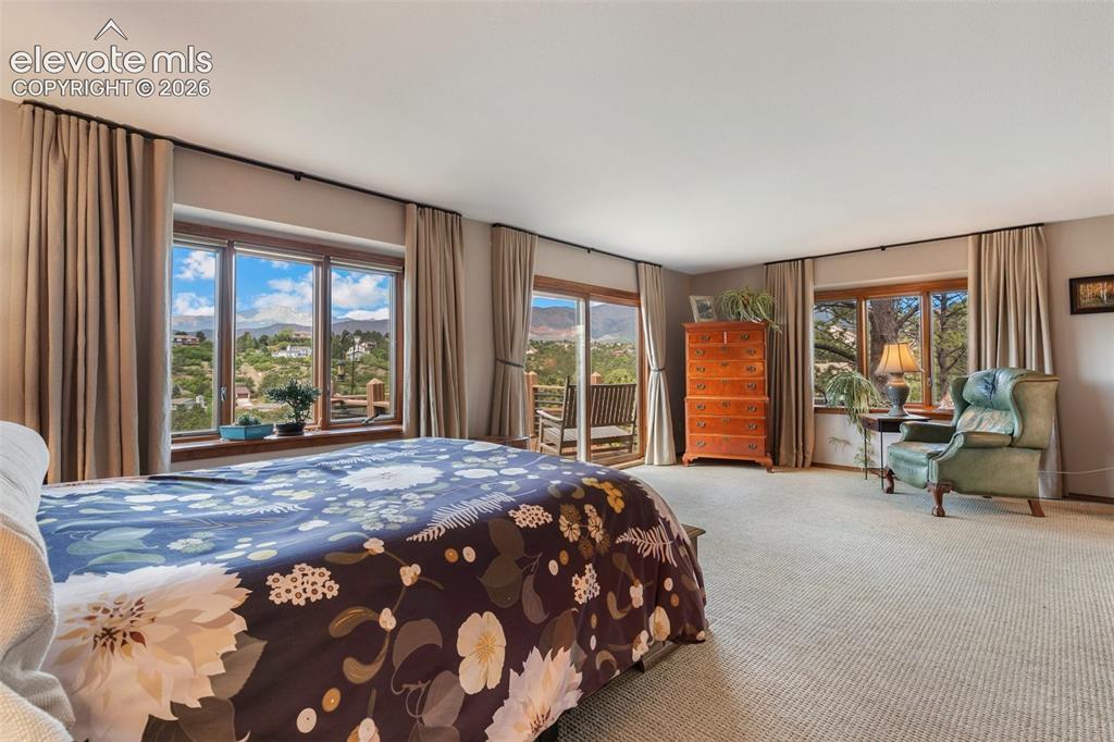 Image 19 of 50: Main level master with private deck with million $$ views!