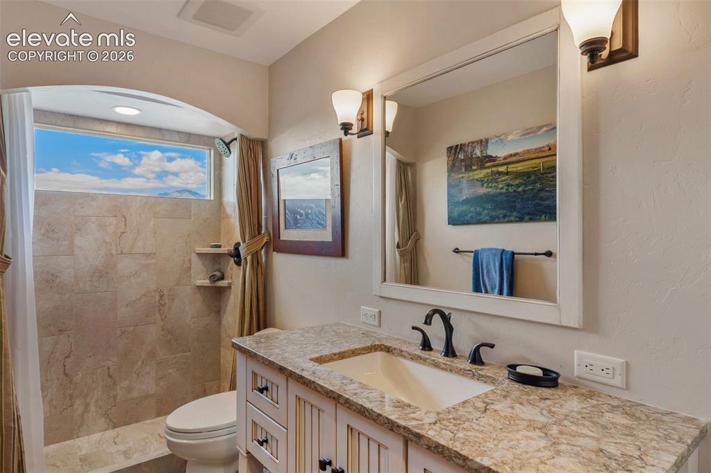 Image 20 of 50: 3/4 remodeled bath on the main level
