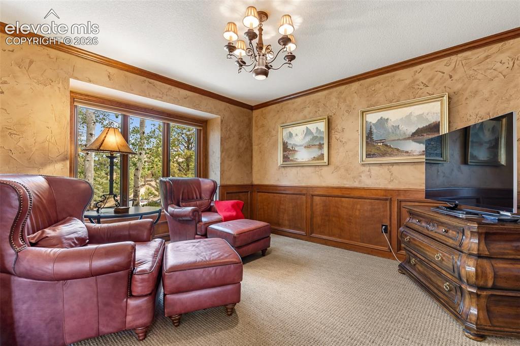 Image 22 of 50: Den or formal dining room, main level