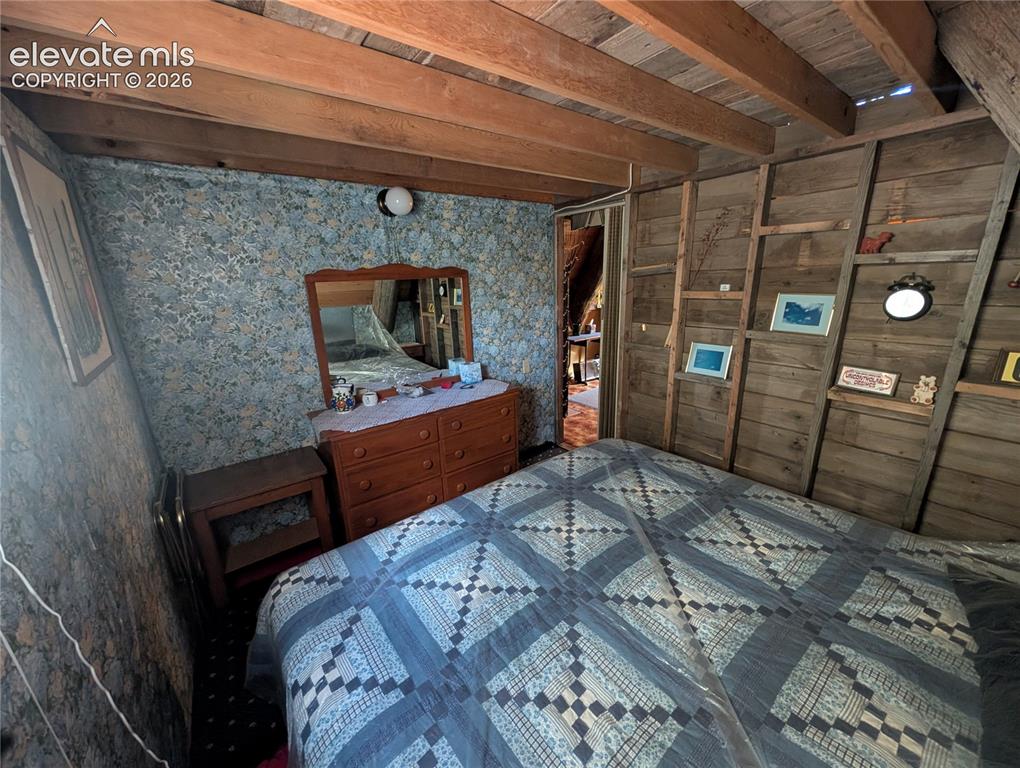 Image 16 of 42: Exposed wood beam ceiling