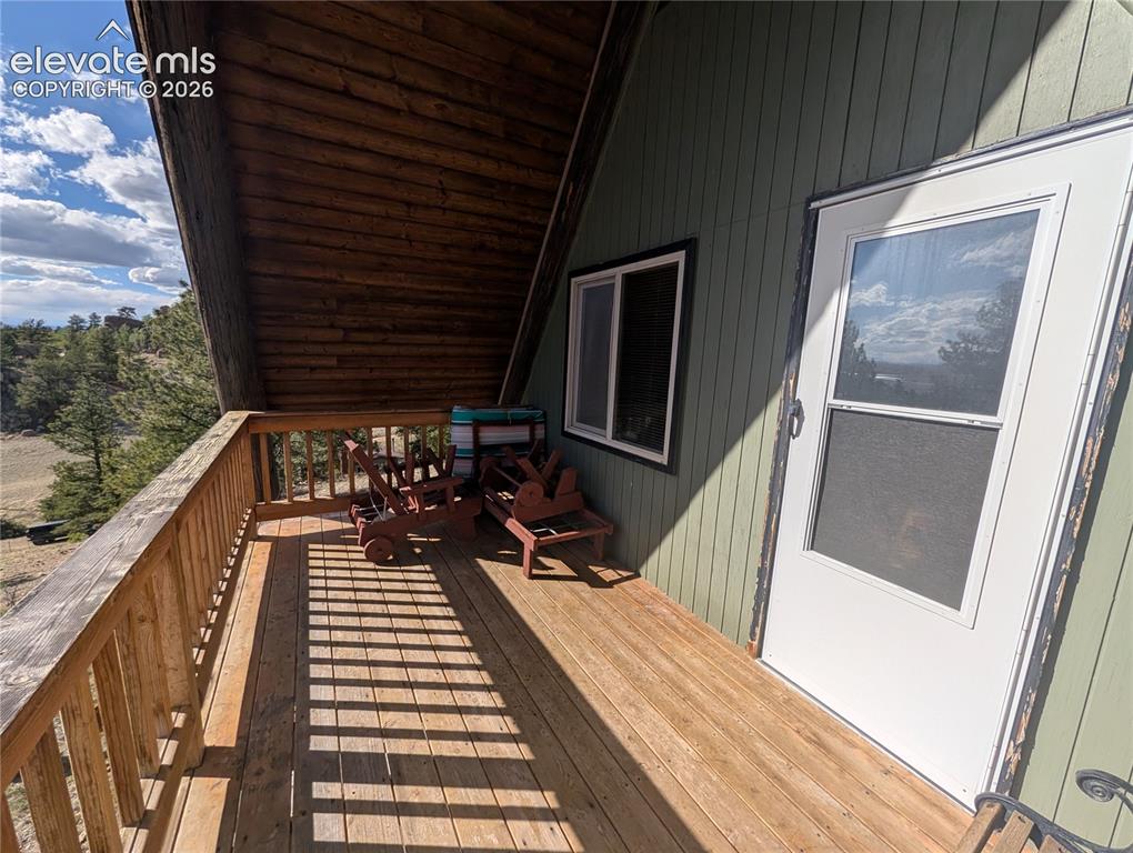 Image 21 of 42: Wood-finish decking with a matching wood-finish railing