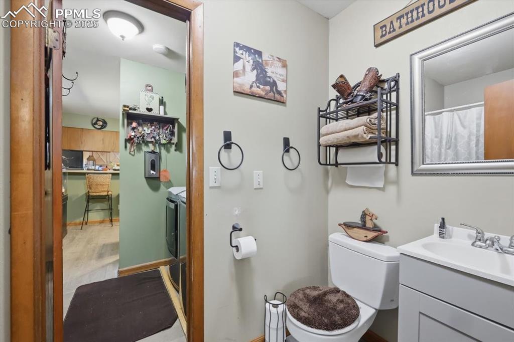 Image 11 of 49: Primary 3/4 bath has an additional door that leads into the laundry area