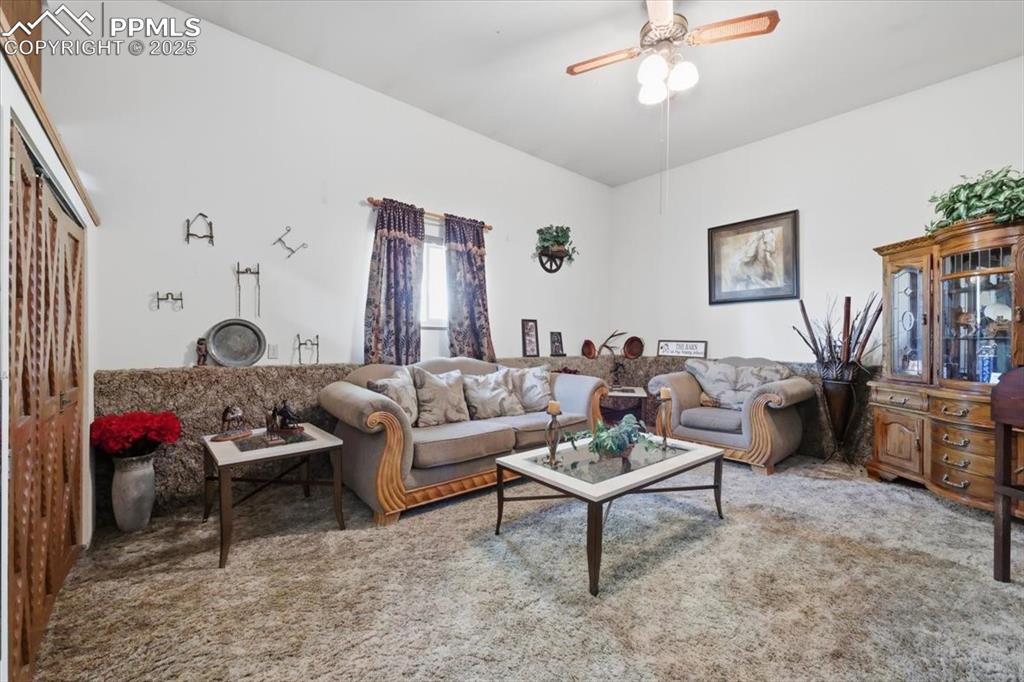 Image 14 of 49: lower level family room with storage cabinets
