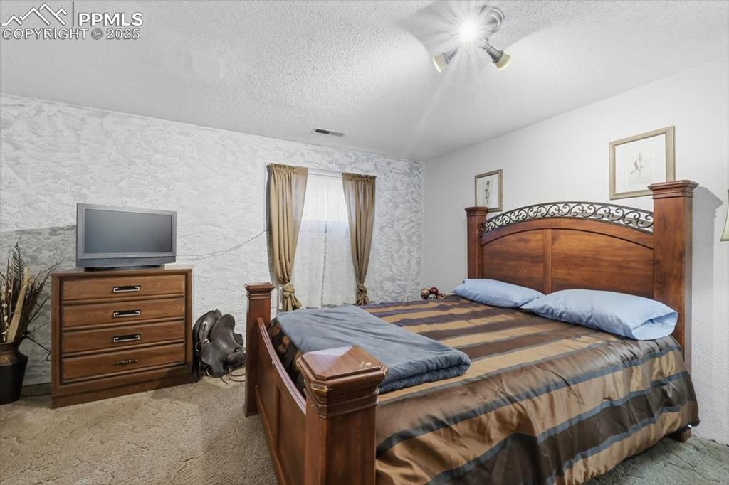 Image 18 of 49: In-law suite bedroom #1