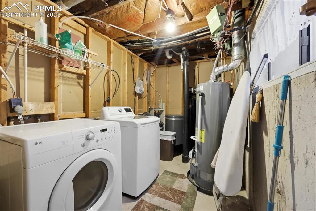 Image 21 of 49: In-law suite laundry room, washer and dryer included