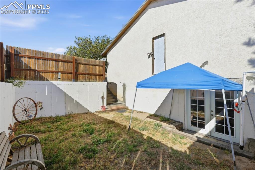 Image 25 of 49: Private yard and entrance for basement in-law suite