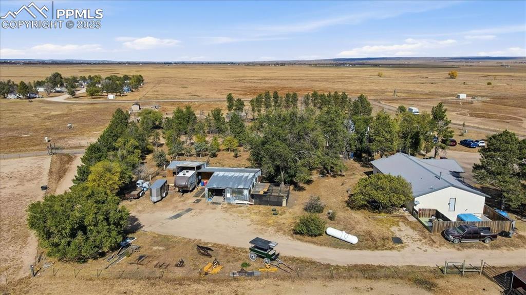 Image 27 of 49: Home and workshop with an attached RV storage