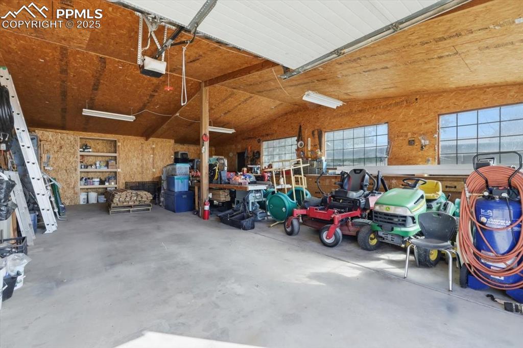 Image 28 of 49: Workshop could house additional vehicles for the car enthusiast. There are