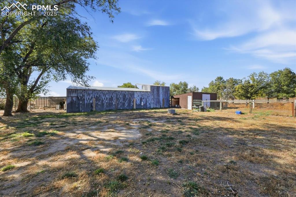 Image 29 of 49: Back of the workshop and small animal enclosure
