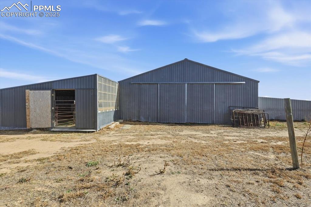 Image 41 of 49: Back of barn. Could add additional boarding areas here.