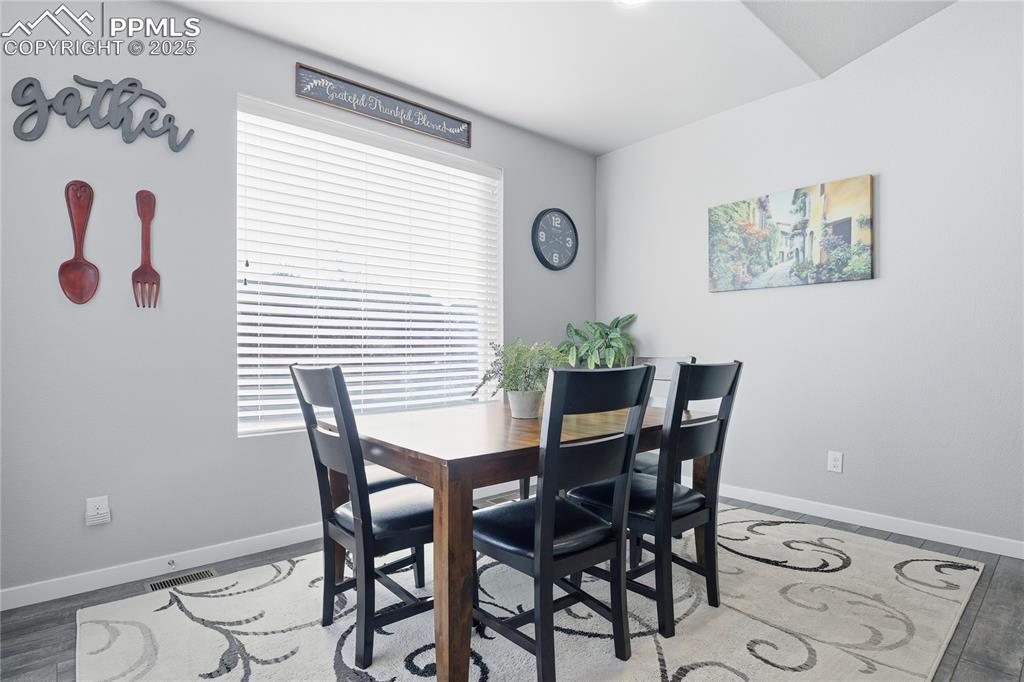 Image 17 of 42: FROM THE DINING AREA TO THE STAMPED CONCRETE PATIO AND GRILLING AREA