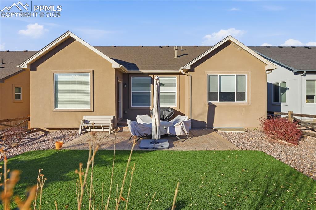 Image 36 of 42: REAR FENCED YARD IS FULLY LANDSCAPED