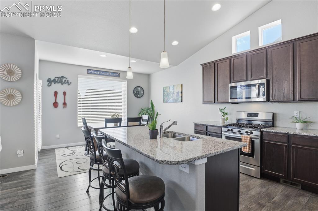 Image 8 of 42: GRANITE COUNTERTOPS, STAINLESS STEEL APPLIANCES, A SPACIOUS PANTRY, AMPLE C