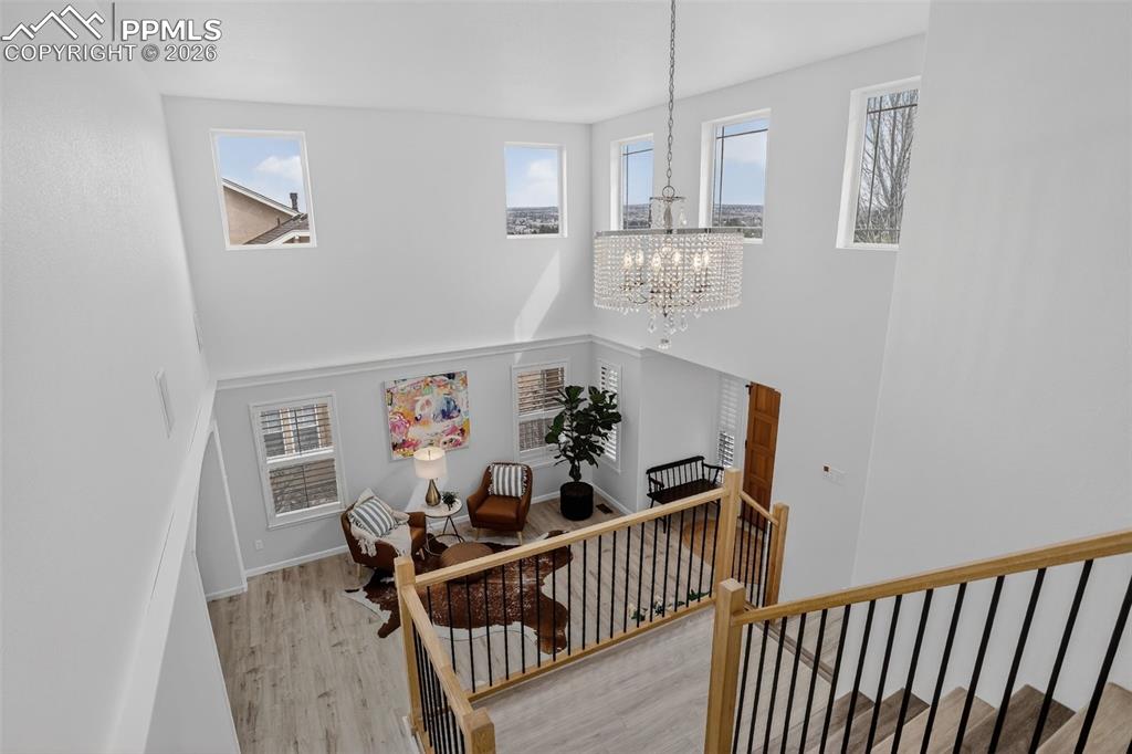 Image 33 of 50: View of living room from upper level hall.