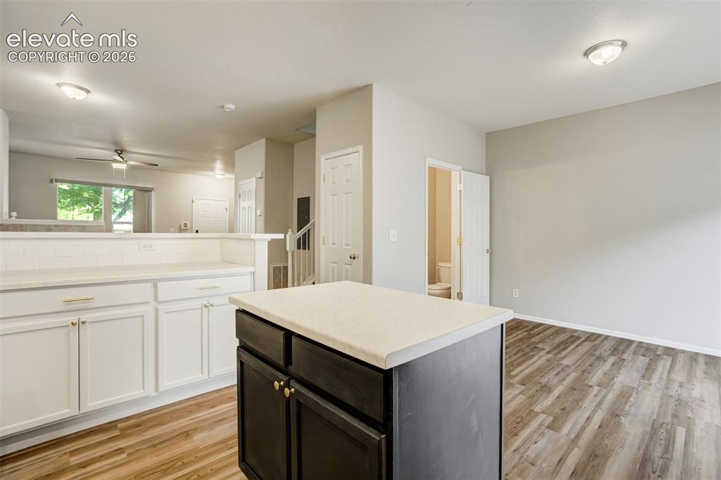 Image 10 of 39: Kitchen island for additional prep space.