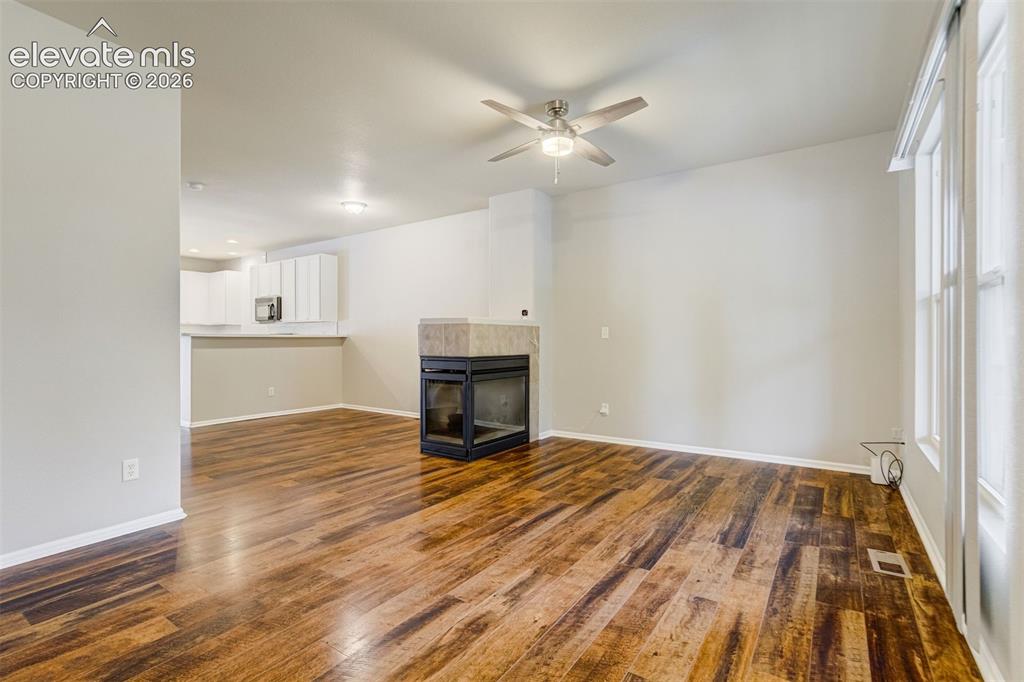 Image 14 of 39: Another look at the living room without any furniture to see the sheer size