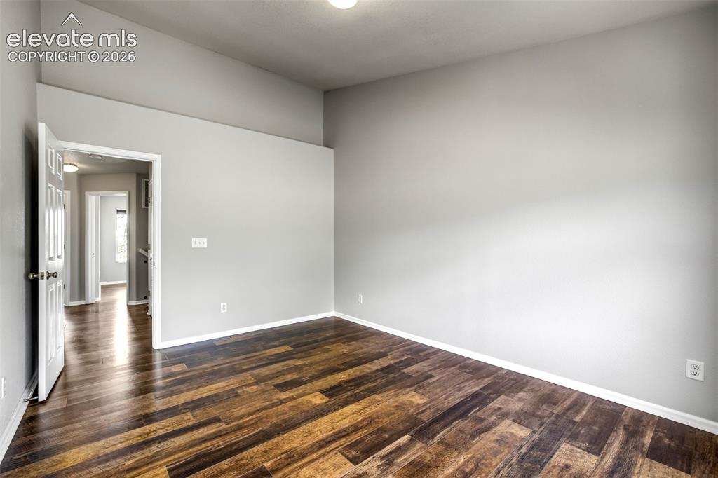Image 18 of 39: Tall ceilings and no carpet- the two things everyone can appreciate. 