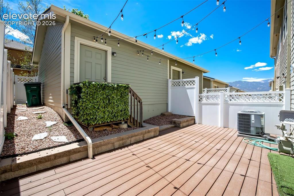 Image 28 of 39: Composite decking, a mountain view, and plenty of privacy.