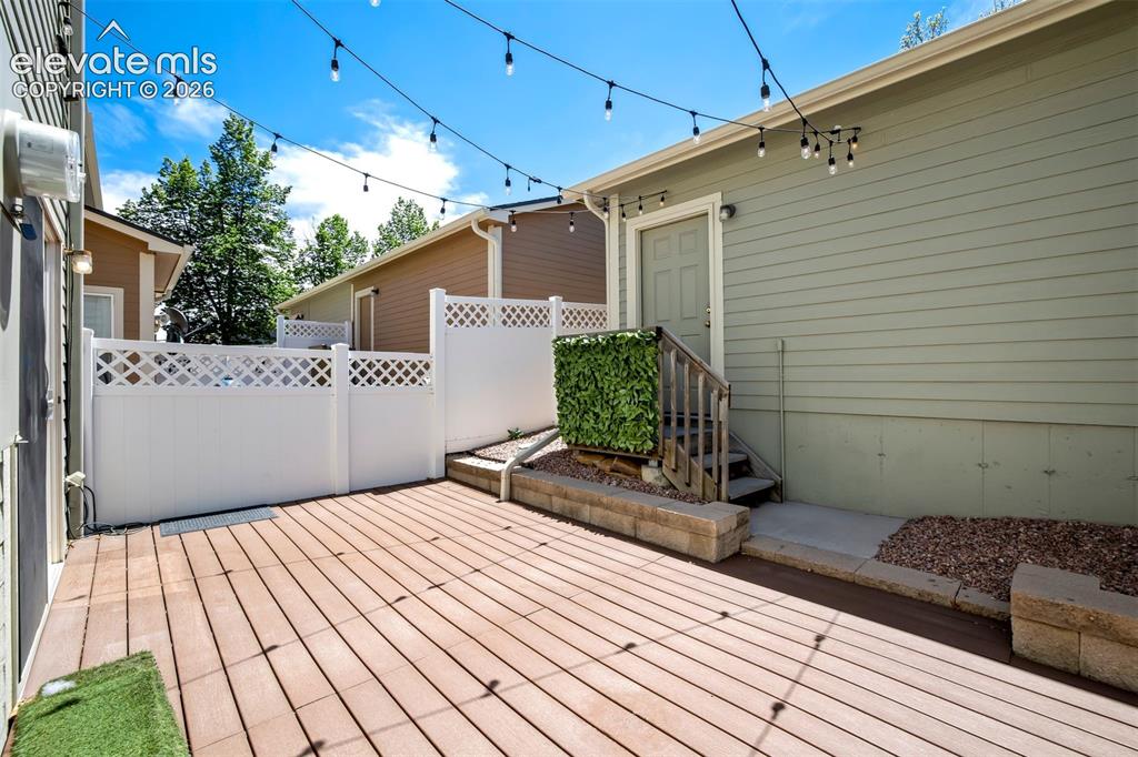 Image 3 of 39: Enclosed back patio that leads to the oversized garage. 