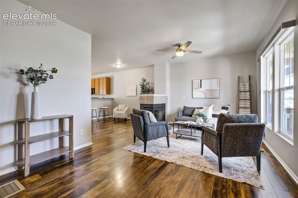 Image 4 of 39: Inviting main level with the perfect amount of natural light & space.