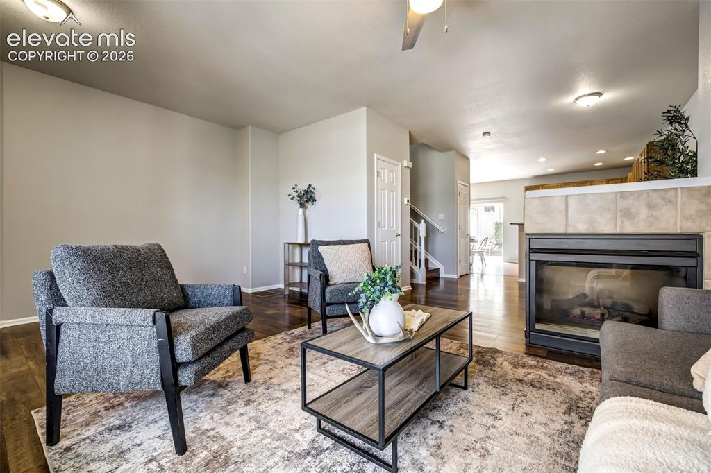 Image 7 of 39: Enjoy the fireplace from the living room or dining room.