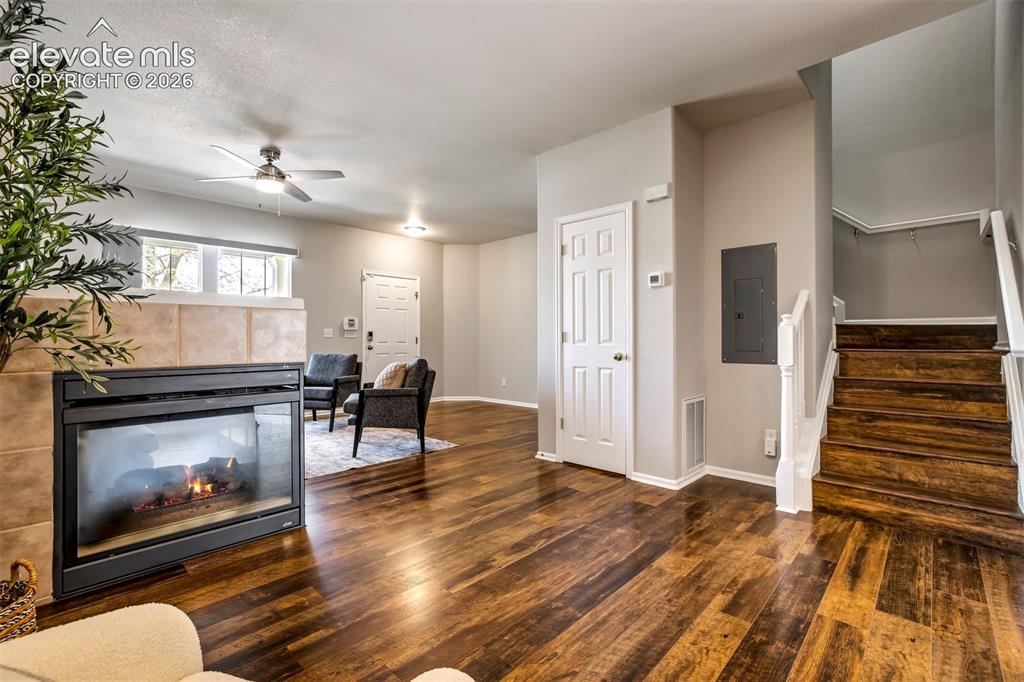 Image 8 of 39: Perfect space for an office / play space / or dining room by the fireplace.