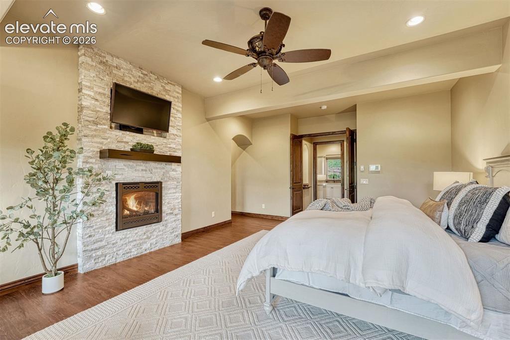 Image 17 of 50: Primary Bedroom with fireplace