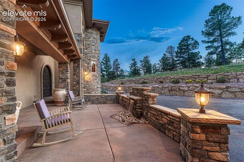 Image 9 of 50: Front courtyard with waterfall