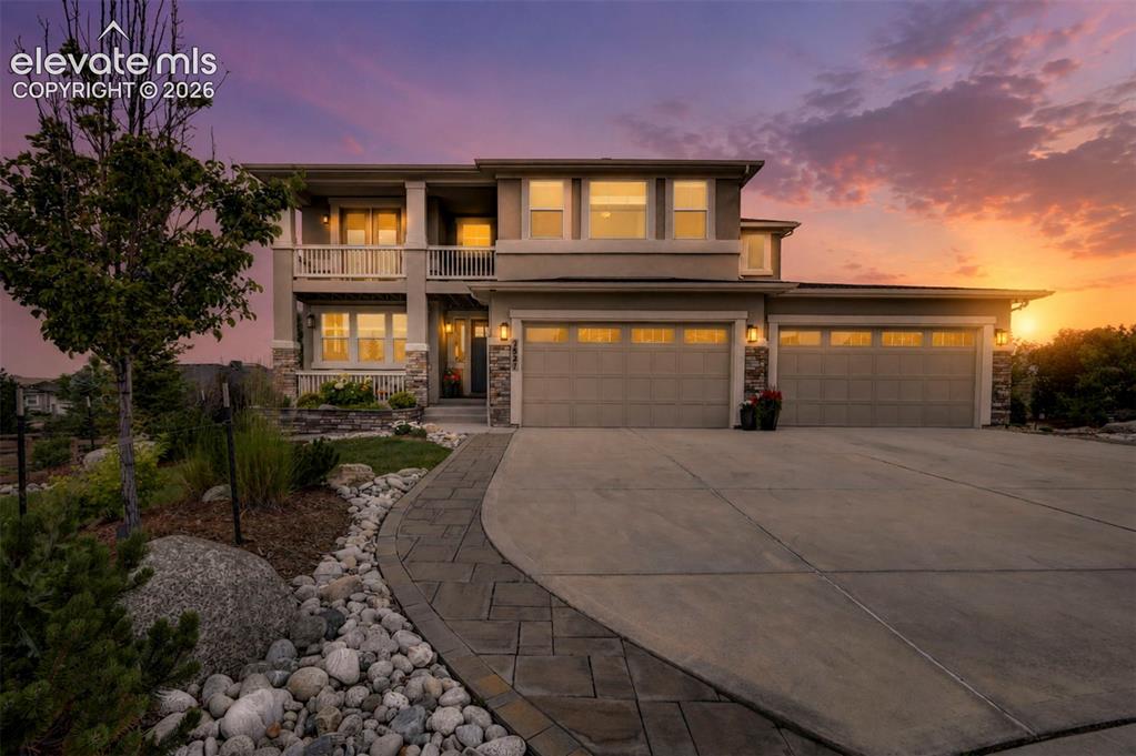 Image 1 of 50: Stunning Front View of Home at Sunset.