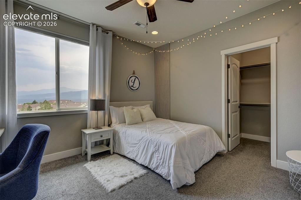 Image 30 of 50: Secondary bedroom (Bedroom 3) with Stunning views of the Front Range!