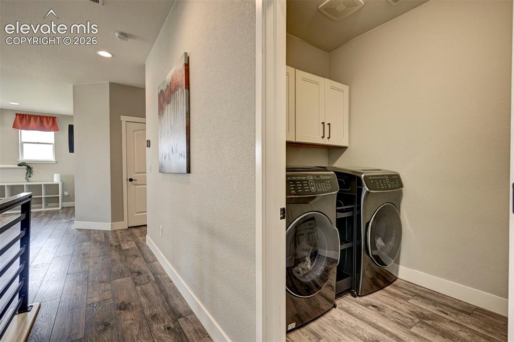 Image 31 of 50: Upstairs Spacious Laundry Room with a Utility Sink & Counter Space.