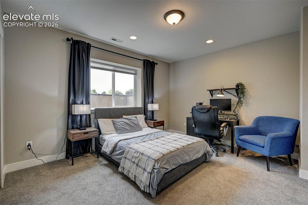 Image 47 of 50: Bedroom 6 in Basement with Stunning views of Pikes Peak.