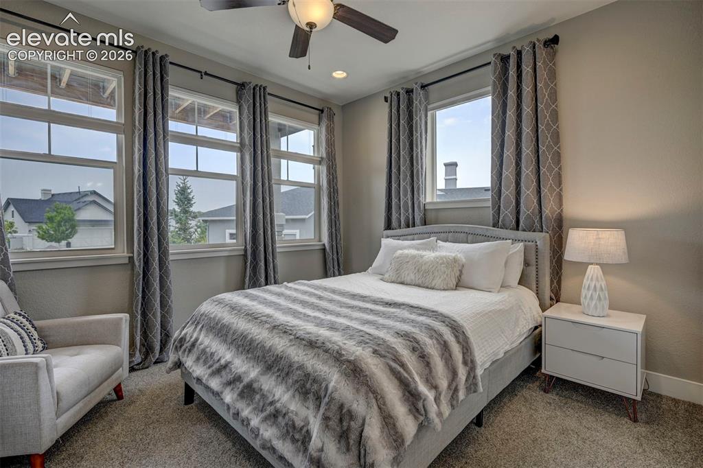 Image 6 of 50: Main Level Bedroom that overlooks the covered front Porch.