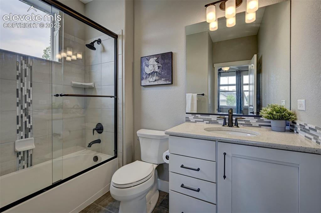 Image 7 of 50: Beautiful Full Bathroom attached to the main level bedroom.